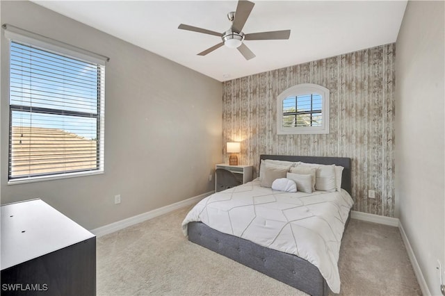 2102 Antigua Ln, Naples, FL 34120 - carpeted bedroom featuring baseboards, an accent wall, ceiling fan, and wallpapered walls