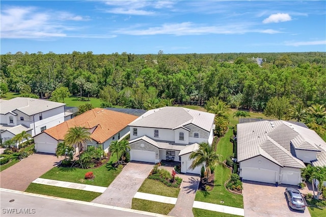 2102 Antigua Ln, Naples, FL 34120 - aerial perspective of suburban area featuring a forest
