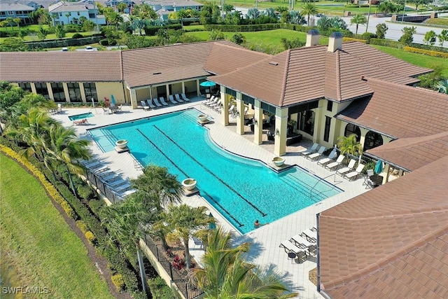 2102 Antigua Ln, Naples, FL 34120 - community pool with a patio