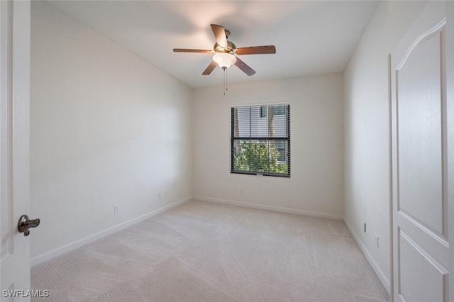unfurnished room with light carpet, ceiling fan, and baseboards