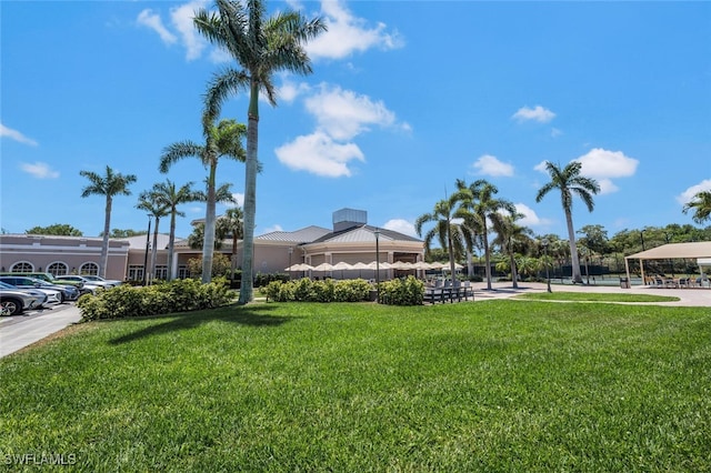 view of community featuring a lawn and a gazebo