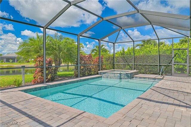 11937 Silver Cobblestone Way, Fort Myers, FL 33913 - view of swimming pool with a water view, a pool with connected hot tub, a lanai, and a patio