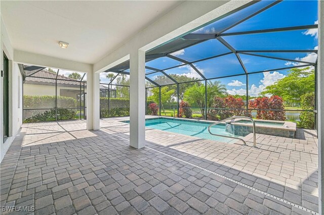 11937 Silver Cobblestone Way, Fort Myers, FL 33913 - view of pool with a patio area, a pool with connected hot tub, and glass enclosure