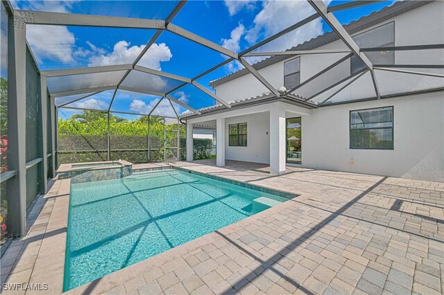 11937 Silver Cobblestone Way, Fort Myers, FL 33913 - view of swimming pool with a patio, a pool with connected hot tub, and a lanai