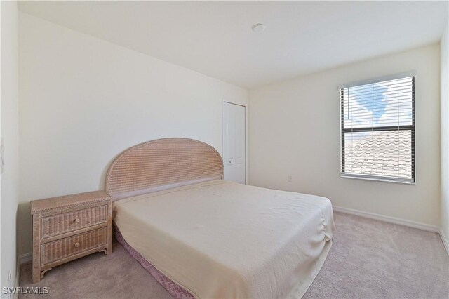 11937 Silver Cobblestone Way, Fort Myers, FL 33913 - bedroom with light carpet and baseboards