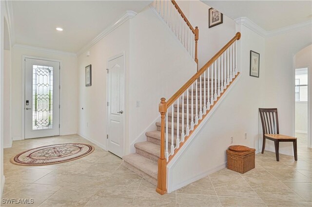 11937 Silver Cobblestone Way, Fort Myers, FL 33913 - entrance foyer featuring arched walkways, ornamental molding, stairway, baseboards, and recessed lighting
