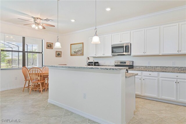 11937 Silver Cobblestone Way, Fort Myers, FL 33913 - kitchen featuring stainless steel appliances, crown molding, white cabinetry, ceiling fan, and light stone countertops