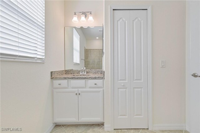 11937 Silver Cobblestone Way, Fort Myers, FL 33913 - full bathroom featuring a closet, vanity, baseboards, and tile patterned floors