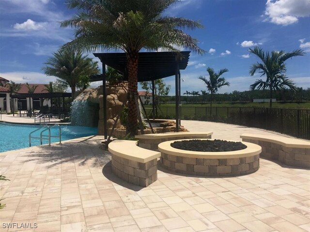 11937 Silver Cobblestone Way, Fort Myers, FL 33913 - community pool featuring a patio and a fire pit