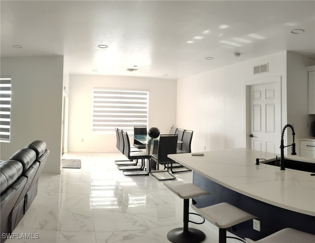 2709 SW 4th Pl, Cape Coral, FL 33914 - dining area with light marble finish floors and recessed lighting