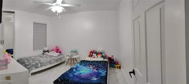 2709 SW 4th Pl, Cape Coral, FL 33914 - bedroom featuring marble look tiles, a ceiling fan, and vaulted ceiling