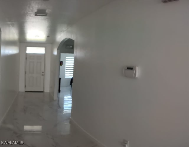2709 SW 4th Pl, Cape Coral, FL 33914 - foyer entrance with arched walkways, marble finish floors, and baseboards