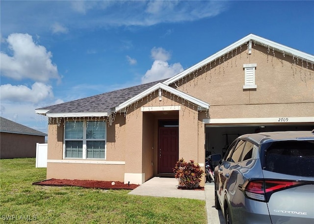 2709 SW 4th Pl, Cape Coral, FL 33914 - view of front of property with stucco siding and a front lawn