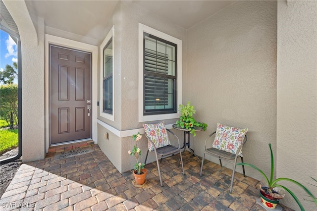 10947 Clarendon St, Fort Myers, FL 33913 - entrance to property featuring stucco siding