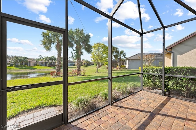 10947 Clarendon St, Fort Myers, FL 33913 - unfurnished sunroom featuring a water view and a residential view