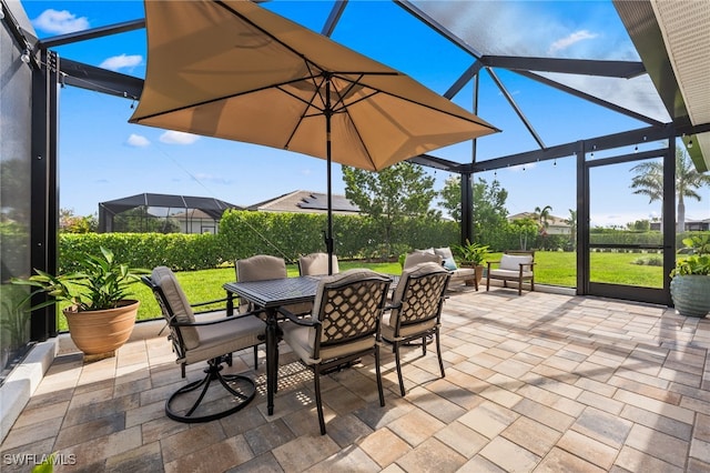 16523 Crescent Beach Way, Bonita Springs, FL 34135 - view of patio with a lanai and outdoor dining area