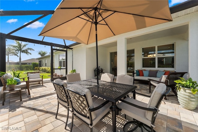 16523 Crescent Beach Way, Bonita Springs, FL 34135 - view of patio / terrace with outdoor lounge area, glass enclosure, and outdoor dining space