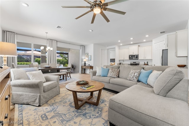 16523 Crescent Beach Way, Bonita Springs, FL 34135 - living area featuring ceiling fan, recessed lighting, a chandelier, and light wood-type flooring