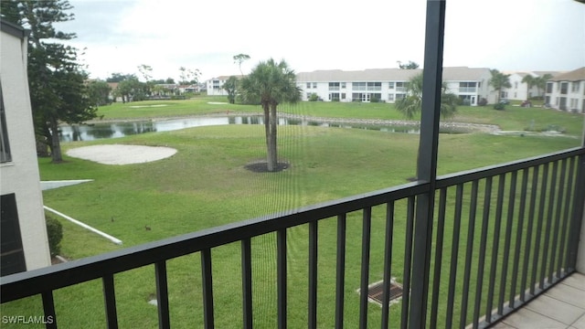 17156 Ravens Roost Unit 7, Fort Myers, FL 33908 - view of grassy yard featuring a water view and a balcony