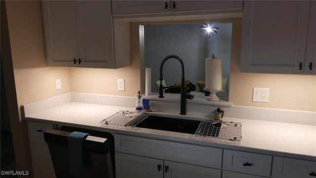 17156 Ravens Roost Unit 7, Fort Myers, FL 33908 - kitchen featuring light countertops, a sink, dishwasher, and gray cabinets