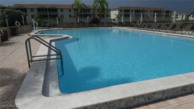 17156 Ravens Roost Unit 7, Fort Myers, FL 33908 - community pool featuring a residential view