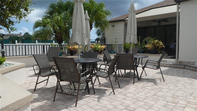 17156 Ravens Roost Unit 7, Fort Myers, FL 33908 - view of patio with outdoor dining space and a ceiling fan