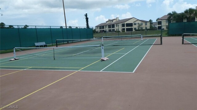 17156 Ravens Roost Unit 7, Fort Myers, FL 33908 - view of tennis court featuring community basketball court
