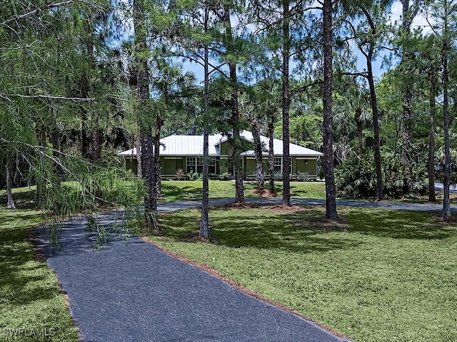 241 25th St NW, Naples, FL 34120 - view of community featuring a yard