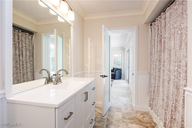 241 25th St NW, Naples, FL 34120 - full bathroom featuring crown molding, vanity, and wainscoting
