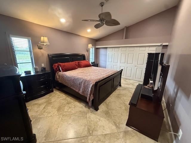 1200 Elaine Ave N, Lehigh Acres, FL 33971 - bedroom featuring vaulted ceiling, ceiling fan, and recessed lighting