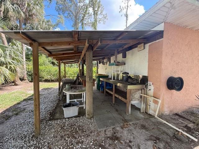 1200 Elaine Ave N, Lehigh Acres, FL 33971 - view of patio / terrace