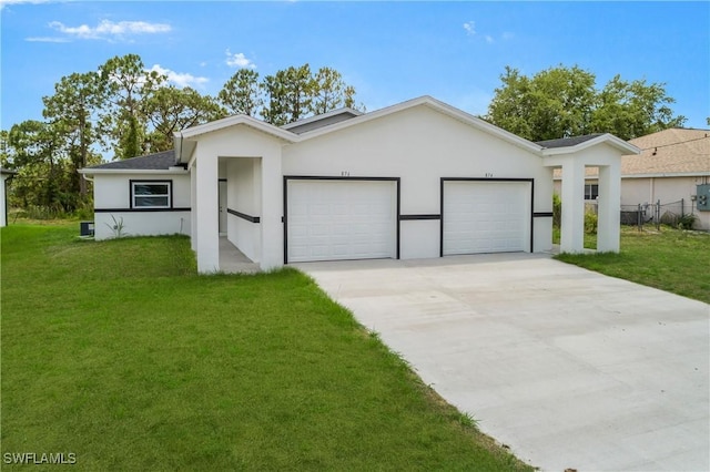 876 Apartment St E, Lehigh Acres, FL 33974 - view of front facade featuring a garage, stucco siding, and driveway