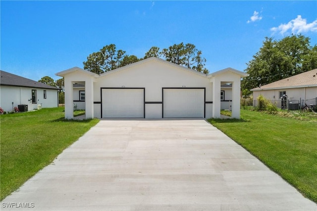 876 Apartment St E, Lehigh Acres, FL 33974 - contemporary house featuring an attached garage, concrete driveway, central AC, and stucco siding