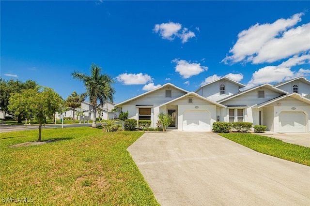13670 Abbey Dr Unit 4, Fort Myers, FL 33919 - view of front facade featuring concrete driveway, a garage, and a front lawn