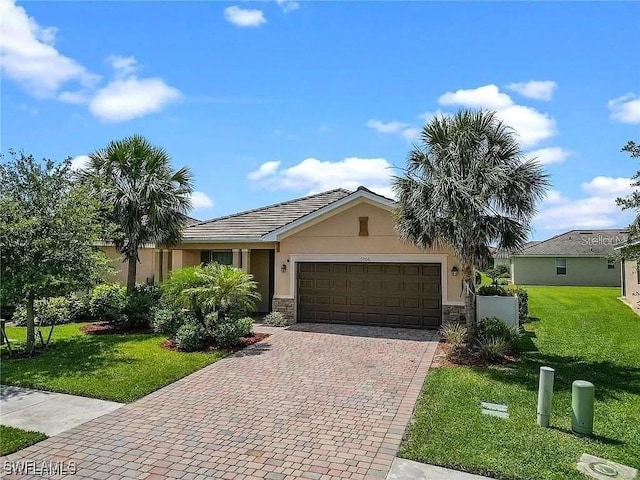 16006 Mistflower Dr, Alva, FL 33920 - ranch-style home featuring stone siding, a garage, stucco siding, and a front yard