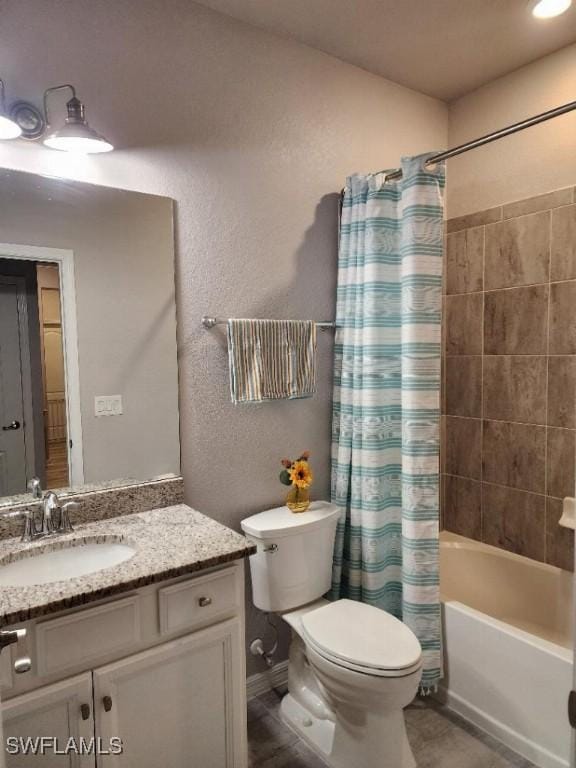 16006 Mistflower Dr, Alva, FL 33920 - bathroom with vanity, a textured wall, and shower / tub combo with curtain