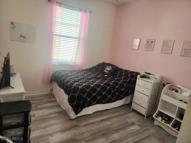 16006 Mistflower Dr, Alva, FL 33920 - bedroom featuring wood finished floors