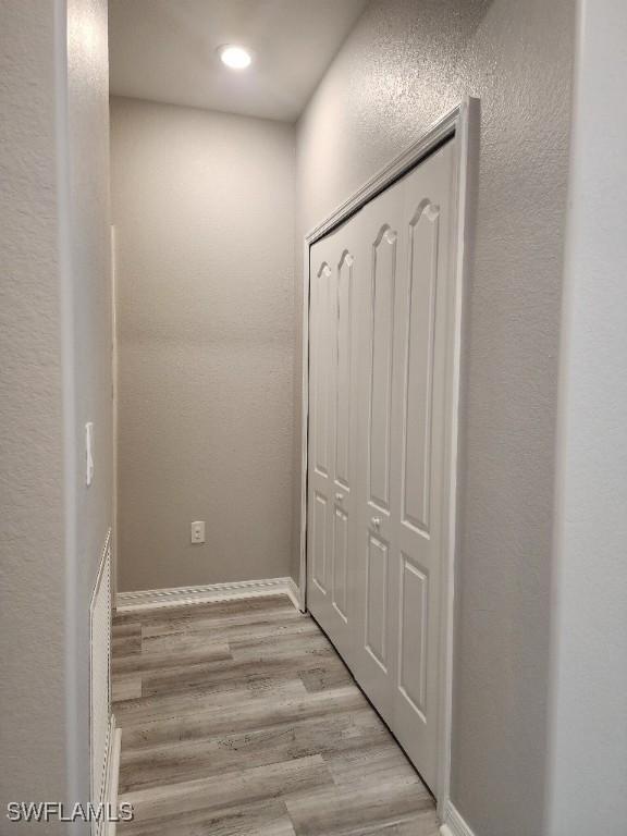 16006 Mistflower Dr, Alva, FL 33920 - hall featuring light wood finished floors and recessed lighting