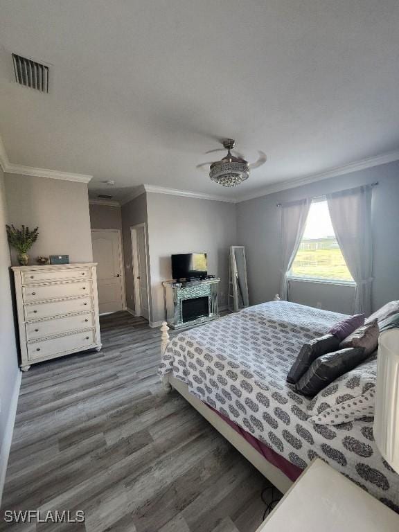 16006 Mistflower Dr, Alva, FL 33920 - bedroom with wood finished floors, ornamental molding, and ceiling fan