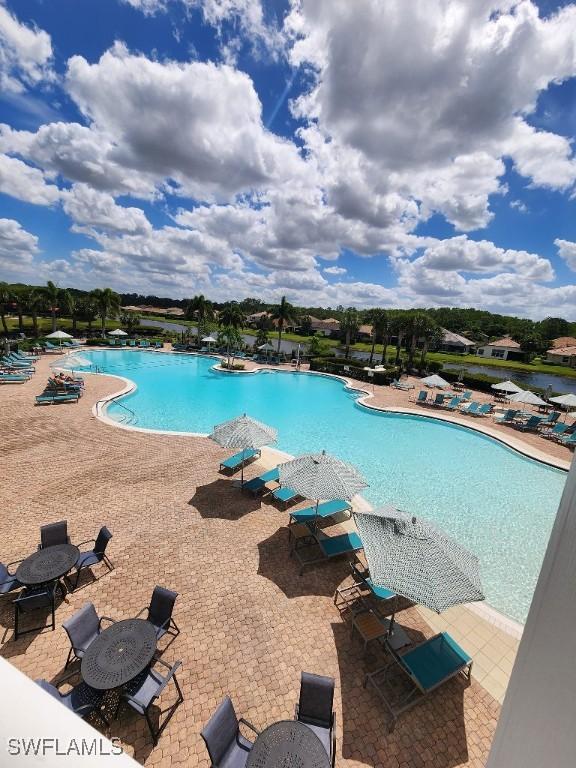 16006 Mistflower Dr, Alva, FL 33920 - community pool featuring a patio area