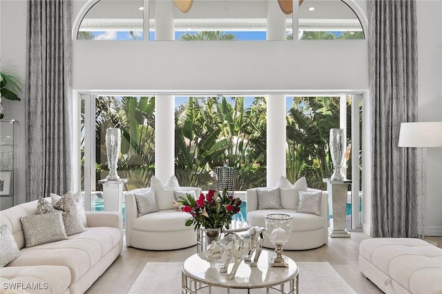 287 Meadowlark Ct, Marco Island, FL 34145 - living area featuring a towering ceiling, healthy amount of natural light, wood finished floors, and a ceiling fan