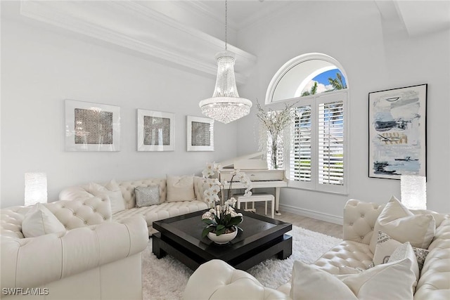 287 Meadowlark Ct, Marco Island, FL 34145 - living room with plenty of natural light, crown molding, a chandelier, baseboards, and wood finished floors