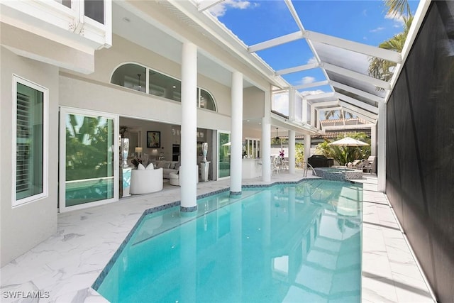 287 Meadowlark Ct, Marco Island, FL 34145 - view of pool featuring a patio, a lanai, and a pool with connected hot tub