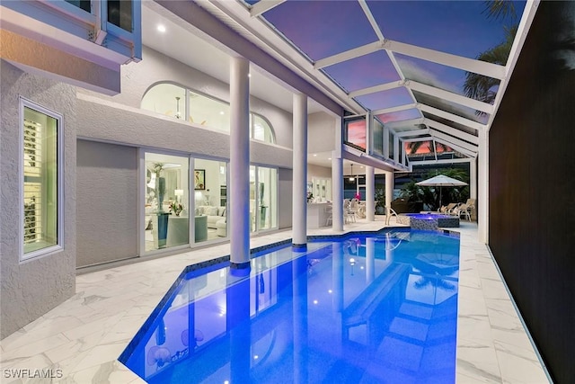 287 Meadowlark Ct, Marco Island, FL 34145 - view of swimming pool with a patio, glass enclosure, and a pool with connected hot tub