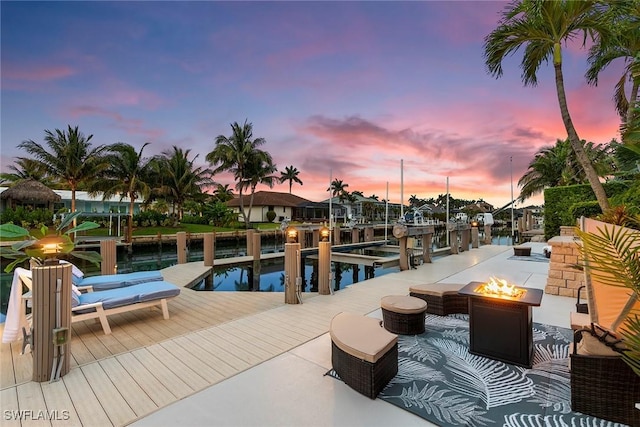287 Meadowlark Ct, Marco Island, FL 34145 - view of swimming pool with a fire pit, a boat dock, a water view, and boat lift