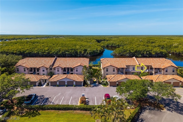 154 Newport Dr Unit 1307, Naples, FL 34114 - bird's eye view of a large body of water and a heavily wooded area