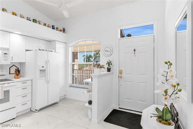 154 Newport Dr Unit 1307, Naples, FL 34114 - kitchen featuring white appliances, light marble finish floors, white cabinetry, light countertops, and baseboards