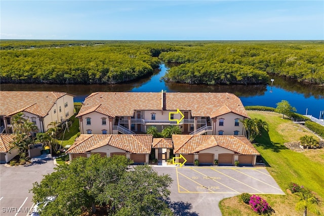 154 Newport Dr Unit 1307, Naples, FL 34114 - drone / aerial view of a nearby body of water and a heavily wooded area