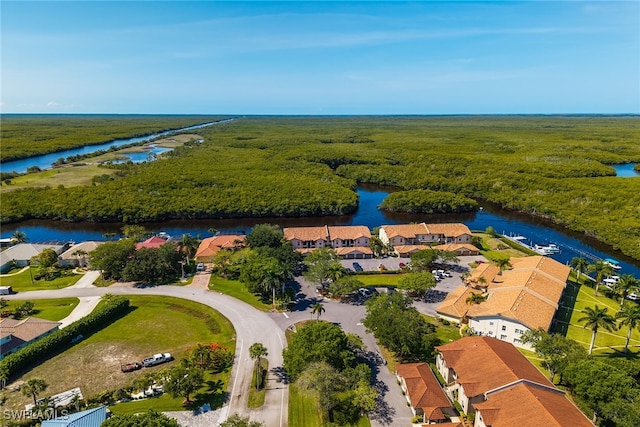 154 Newport Dr Unit 1307, Naples, FL 34114 - aerial view of residential area with a nearby body of water and a forest