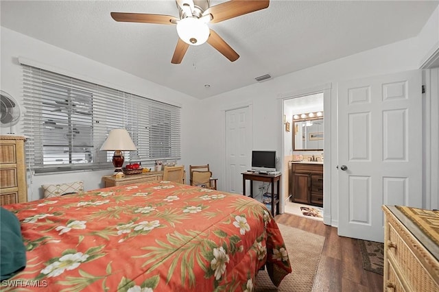 134 Dartmouth Dr NW, Port Charlotte, FL 33952 - bedroom featuring dark wood-type flooring, ensuite bathroom, and ceiling fan